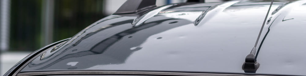 Bumped Car Engine Hood After Heavy Storm As Extreme Weather And