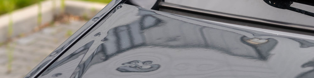 Bumped Car Engine Hood After Heavy Storm As Extreme Weather And